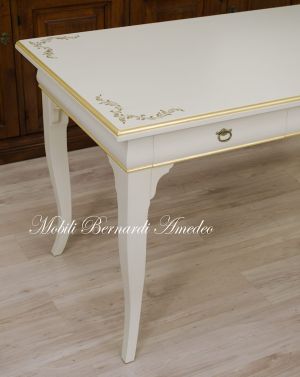 Classic style desk with colored lacquered finish with gold leaf decorations and frames